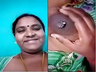 Tamil Auntie Milks her tits